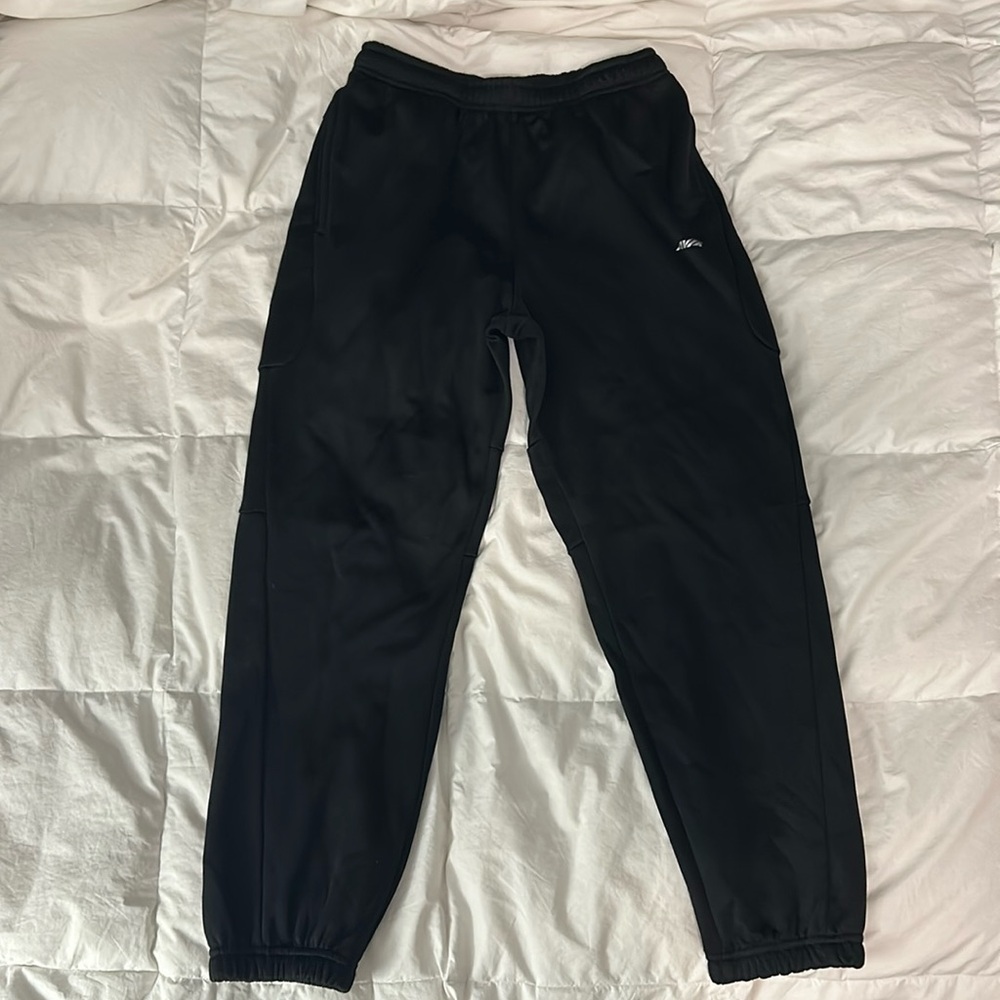 Comfy black joggers with two side pockets. Fits large.